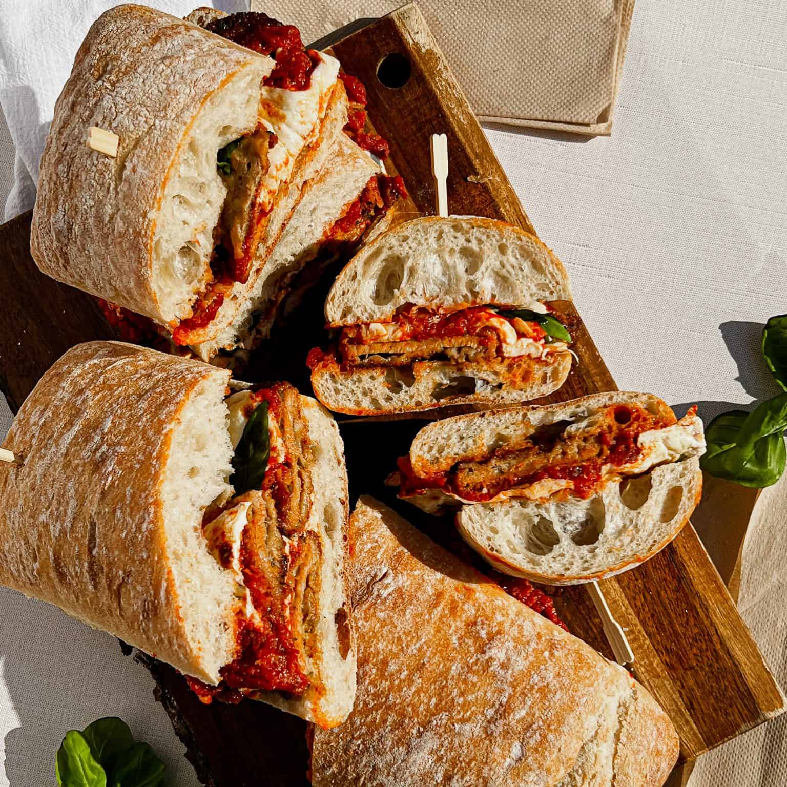 Veal Parmesan Sandwich sliced. featured image